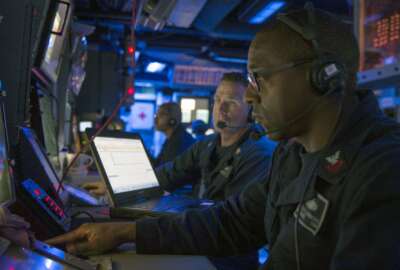 SOUTH PACIFIC (July 9, 2017) Operations Specialist 1st Class Charles Hammond, from Kansas City, Missouri, monitors tracks aboard Arleigh Burke-class guided-missile destroyer USS Sterett (DDG 104) during an air defense exercise comprised of Sterett, amphibious assault ship USS Bonhomme Richard (LHD 6), amphibious transport dock USS Green Bay (LPD 20), amphibious dock landing ship USS Ashland (LSD 48), Royal Australian Navy frigate helicopter HMAS Ballarat (FFH 155), Royal Australian Navy guided missile frigate HMAS Darwin (FFG 04), and Royal Australian Navy frigate helicopter HMAS Toowoomba (FFH 156) as part of Talisman Saber 17. Sterett, part of a combined U.S.-Australia-New Zealand expeditionary strike group (ESG), is undergoing a series of scenarios that will increase proficiencies defending the ESG against blue-water threats so amphibious forces can launch Marine forces ashore in the littorals. Talisman Saber is a biennial U.S.-Australia bilateral exercise held off the coast of Australia meant to achieve interoperability and strengthen the U.S.-Australia alliance. (U.S. Navy photo by Mass Communication Specialist 1st Class Byron C. Linder/Released)170709-N-ZW825-895
